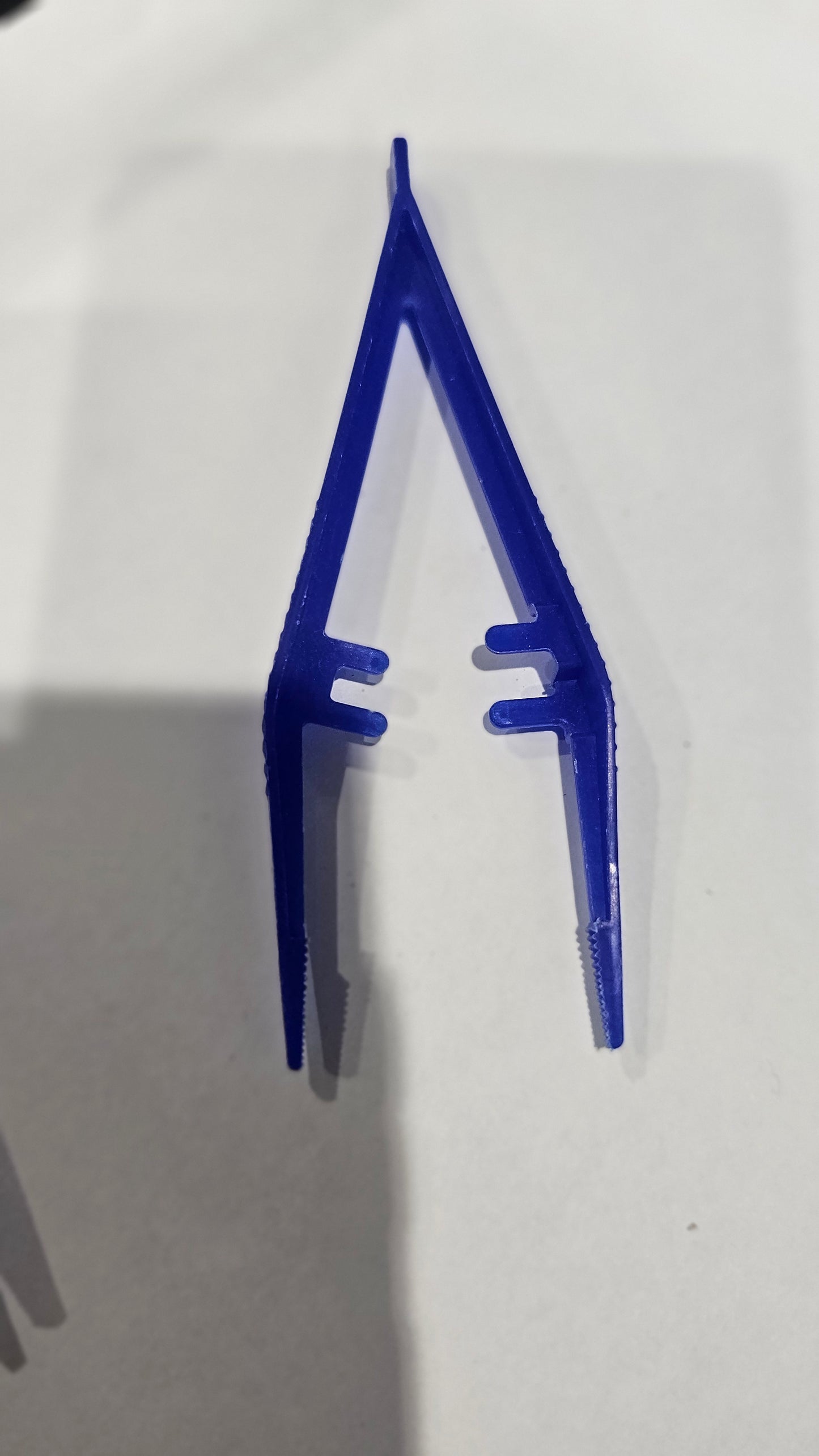 Blue plastic feeding twissers/tongs