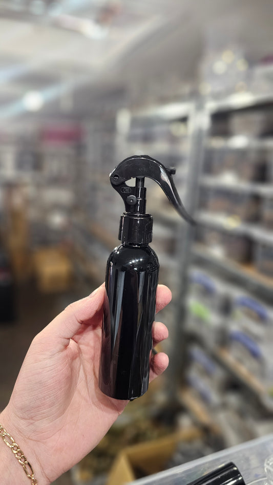 Black plastic spray bottle